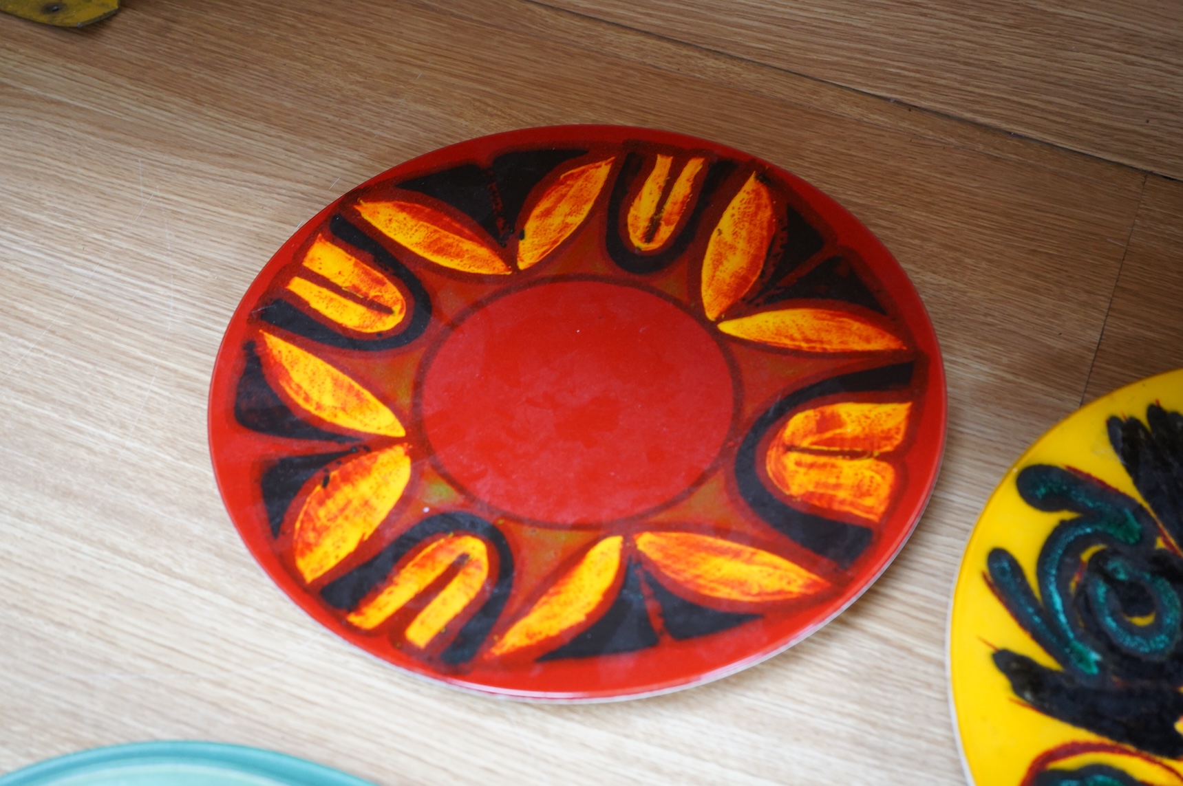 Two mid century Poole pottery Delphis chargers, 36cm in diameter